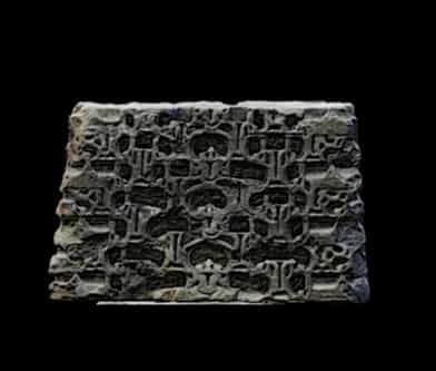 Carved fragment of basalt stone